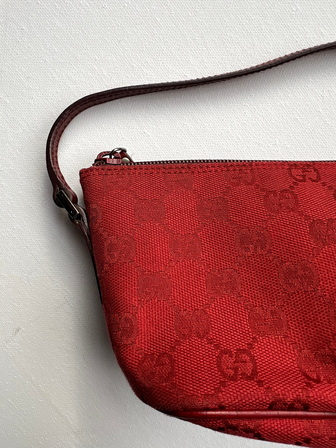 Gucci Monogram Small Pochette in red with top handle